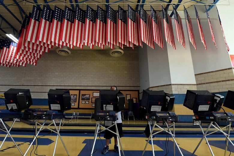 NORTH LAS VEGAS, NV - NOVEMBER 08: A voter casts a ballot at a voting machine at a polling station at Cheyenne High School on Election Day on November 8, 2016 in North Las Vegas, Nevada. Americans across the nation are picking their choice for the next president of the United States. (Photo by Ethan Miller/Getty Images)